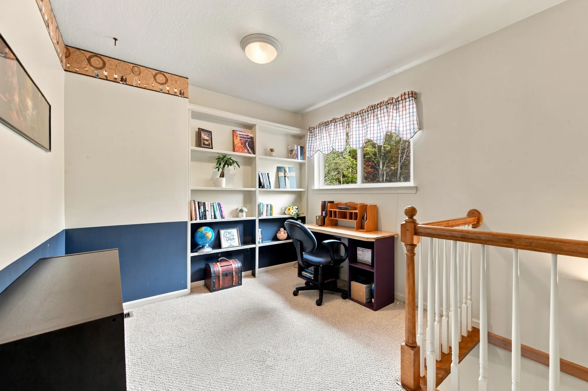Upstairs loft with built-in shelves